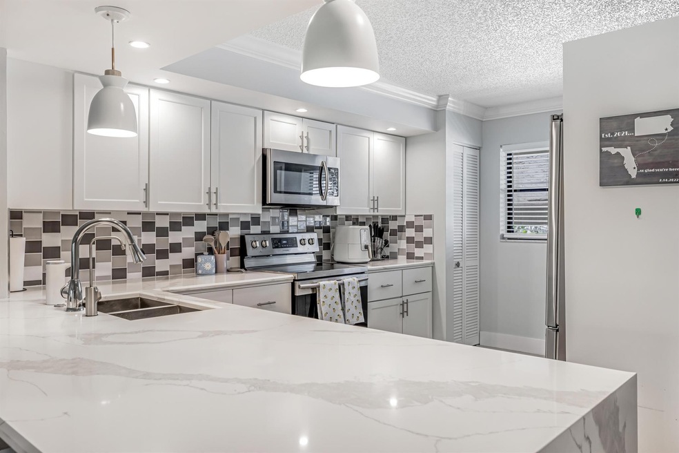 12926 Briarlake Dr unit 201, Palm Beach Gardens, FL 33418 - photo 1