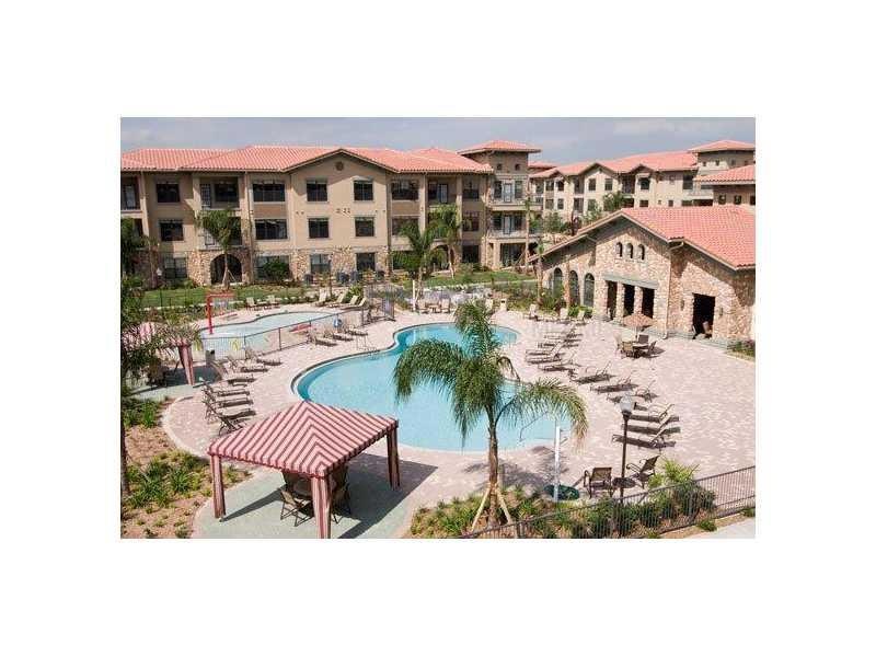 Clubhouse - View of Clubhouse, Main Pool and Kiddie Pool, Cabanas, and Lounge Areas.
