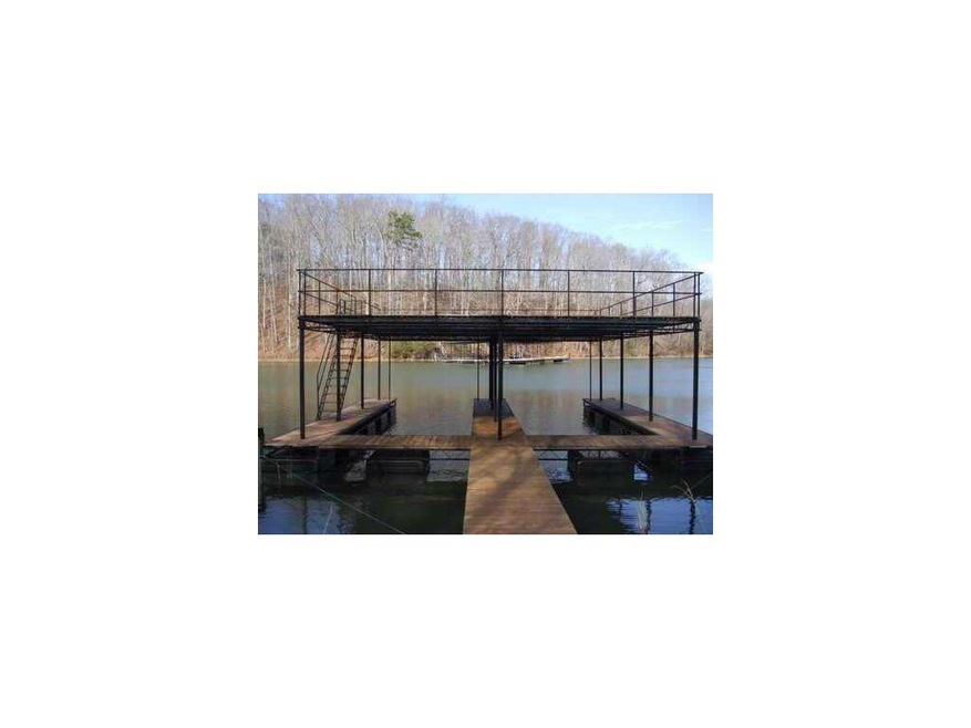 Exterior Front. Double slip dock with party deck