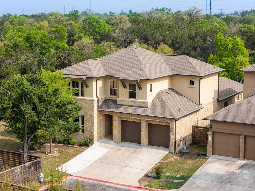 View of front of property featuring stone siding,
