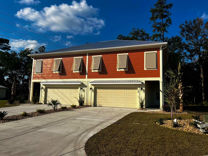 Townhome / multi-family property featuring cooling