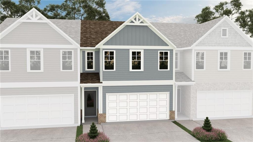 Townhome / multi-family property with driveway, br