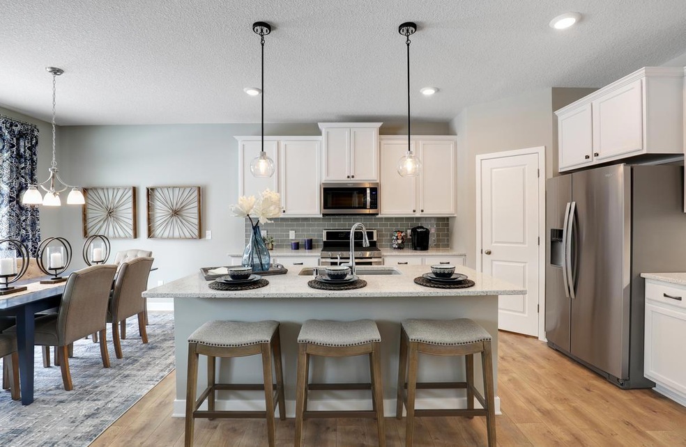 Beautiful kitchen space with a large island for entertaining.  *Photo is of a model home.  Finishes in actual home may differ.