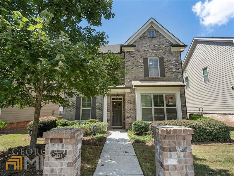 Front of home with gorgeous brick.