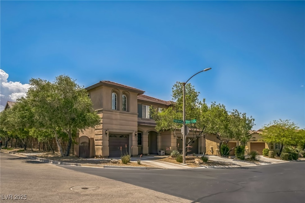 Mediterranean / spanish-style house featuring a ga