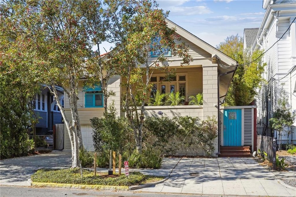 Front with tons of parking and covered porch