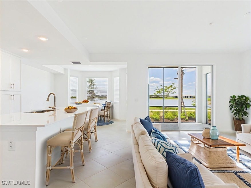 Living room featuring light tile patterned floors