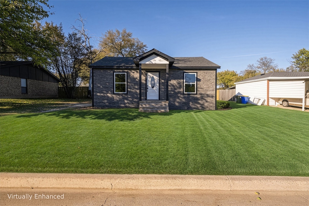 Bungalow-style house featuring brick siding and roof with shingles