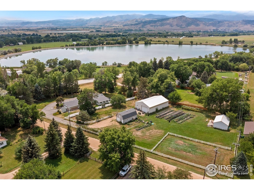 12745 N 66th, located directly across from McCall Lake with a sprawling 1.8 acres including irrigated organic beds