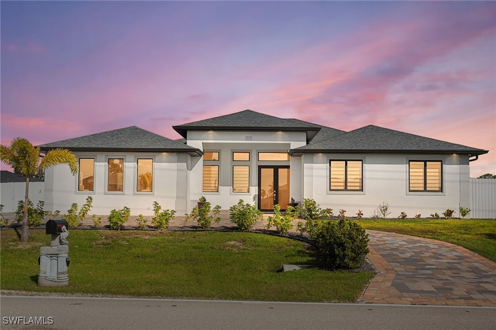 Luxurious style house with a shingled roof, a fron