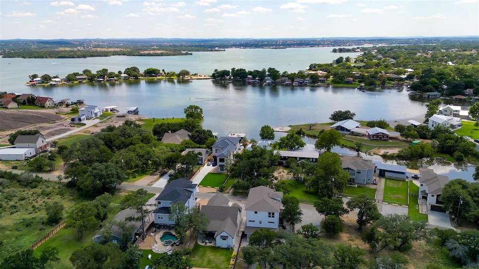 Aerial view of residential area with a large body