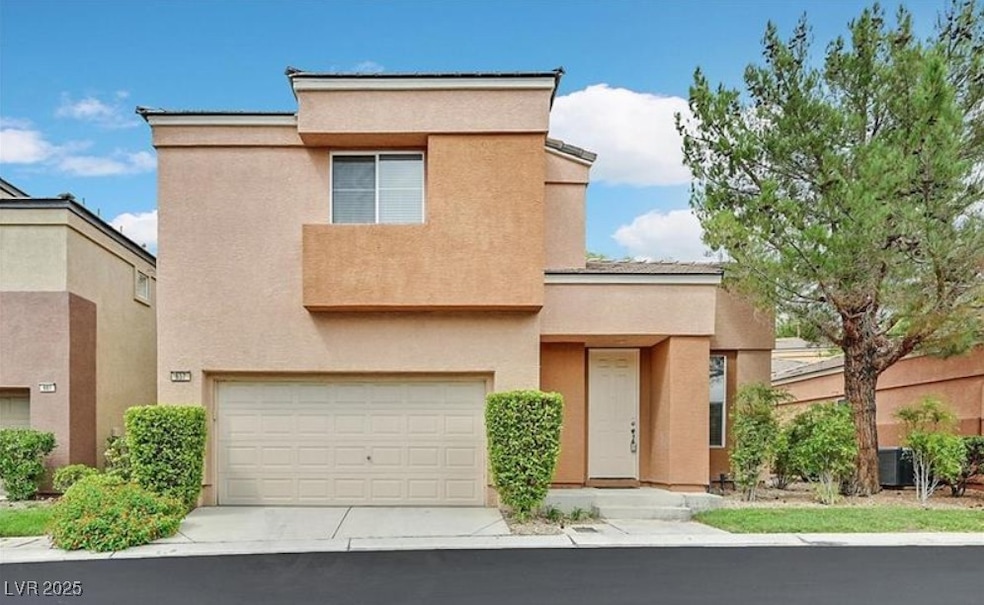 View of front of property with concrete driveway,