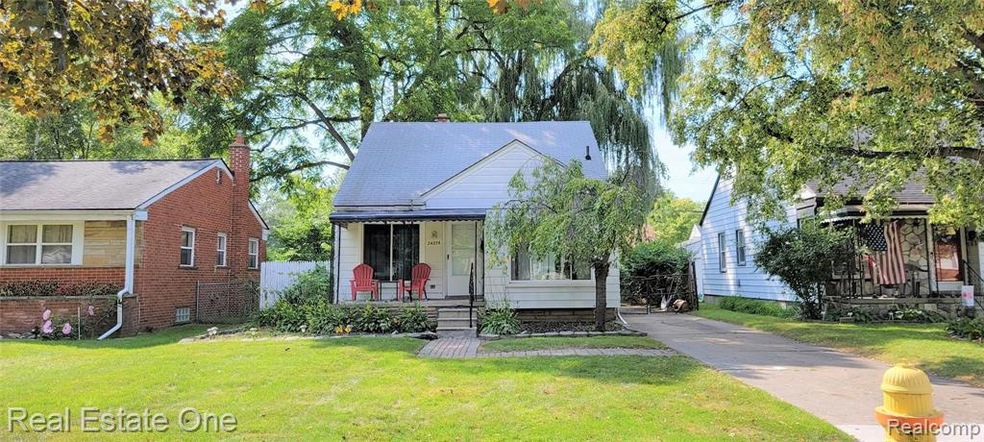 Brick walkway greets your guests. Covered porch !