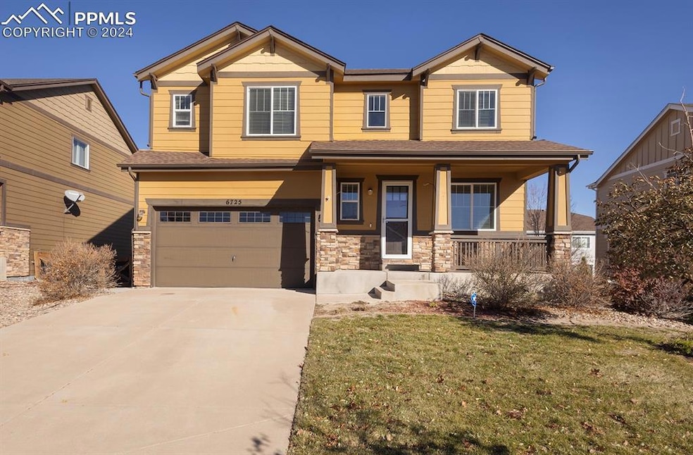 Craftsman-style house with a front yard, a porch, 