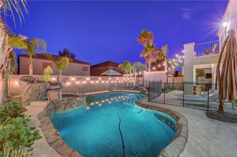 Pool at twilight featuring a fenced backyard, a pa