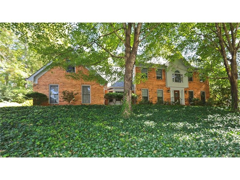 Front yard with mature foliage