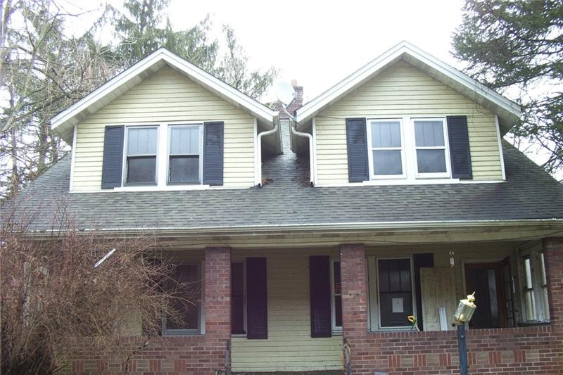 Front of duplex showing large porch with separate 