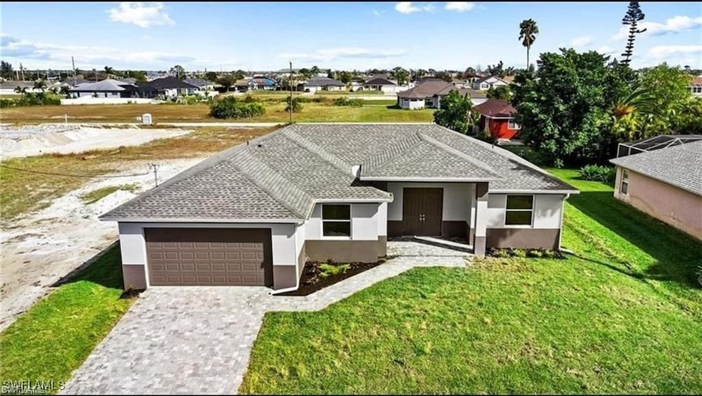 Single story home featuring stucco siding, an atta