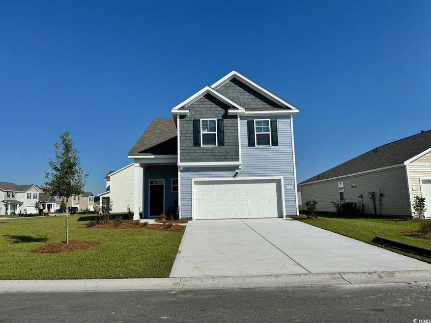 View of front of property with a front yard and a 