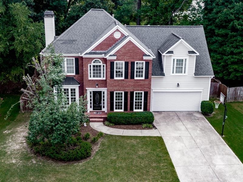 Brick front home on level private lot located in s