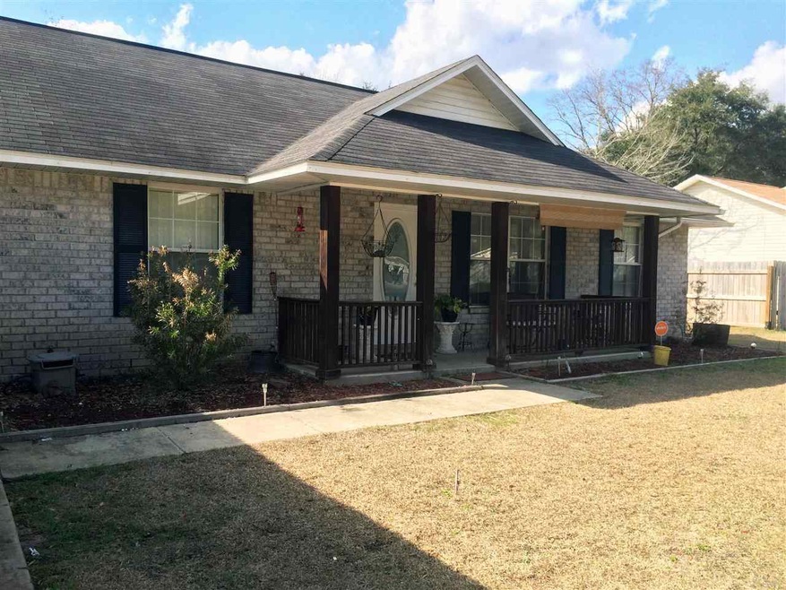 Brick front, vinyl siding on remaining sides.