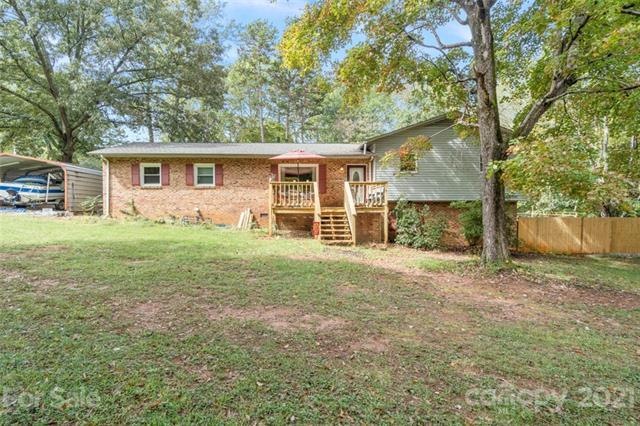 Brick Accented home w/ Burgundy Shutters & Cozy Front Porch (Carport & Boat Do not Convey)