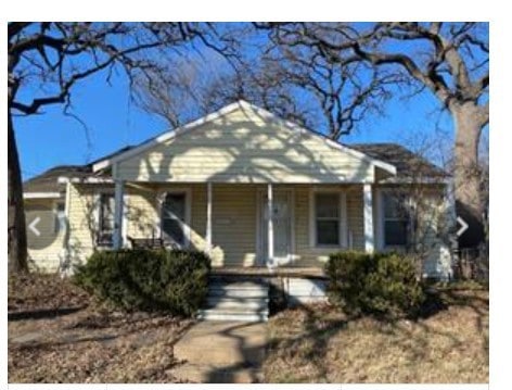 Bungalow featuring covered porch