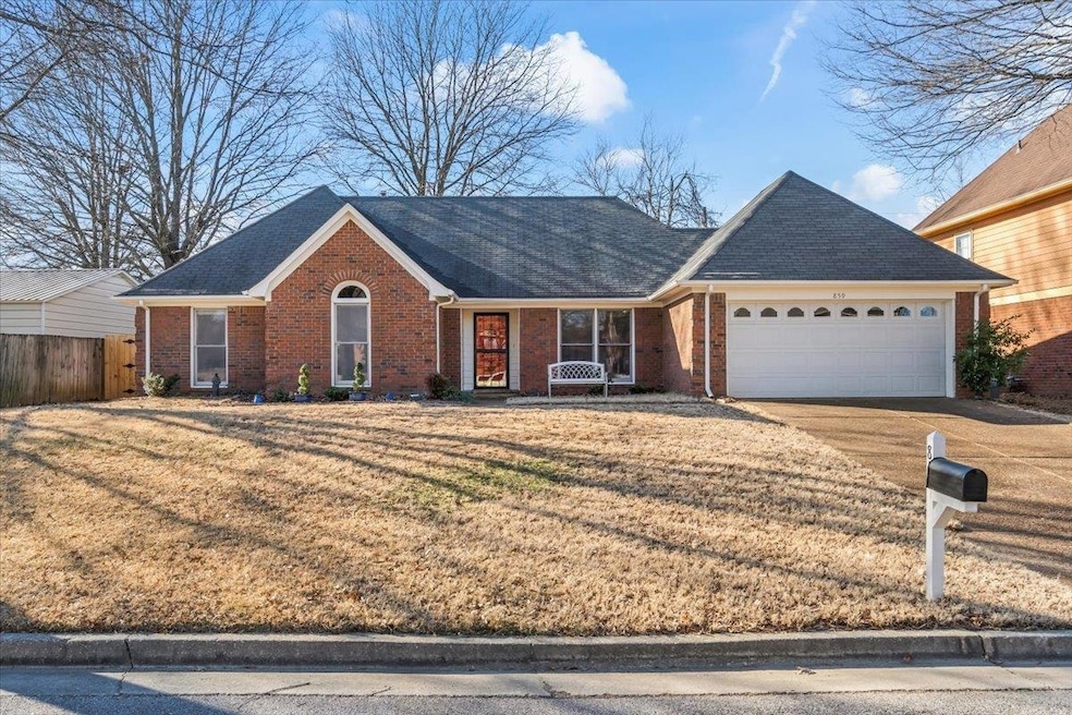 View of front of property with a garage and a fron