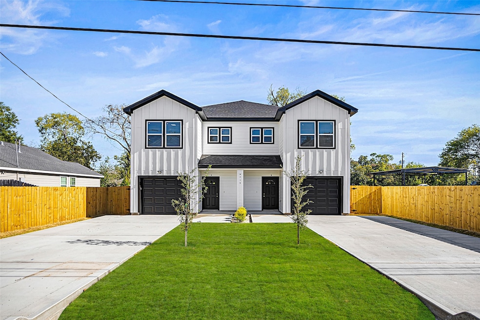 Sleek and symmetrical, this striking modern duplex features clean architectural lines, expansive picture windows, and a bold, contemporary entry that sets the stage for elevated, design-forward living.