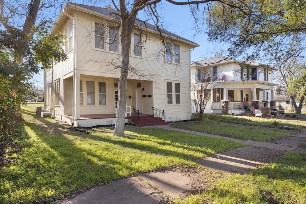 View of front of property with a front lawn