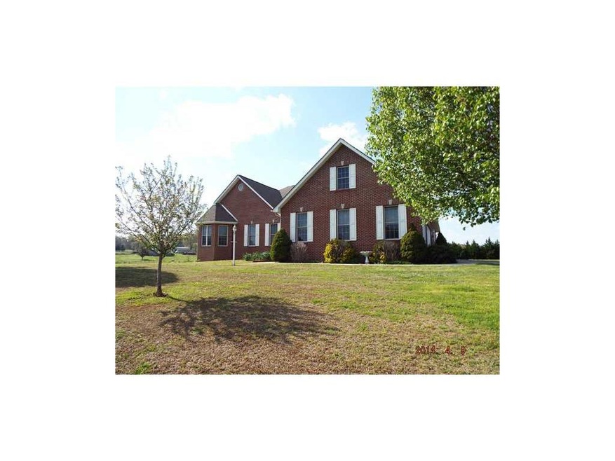 Exterior Front. Expansive, four-sided brick beauty