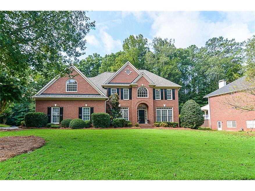Beautiful 3 side brick home with side entry garage