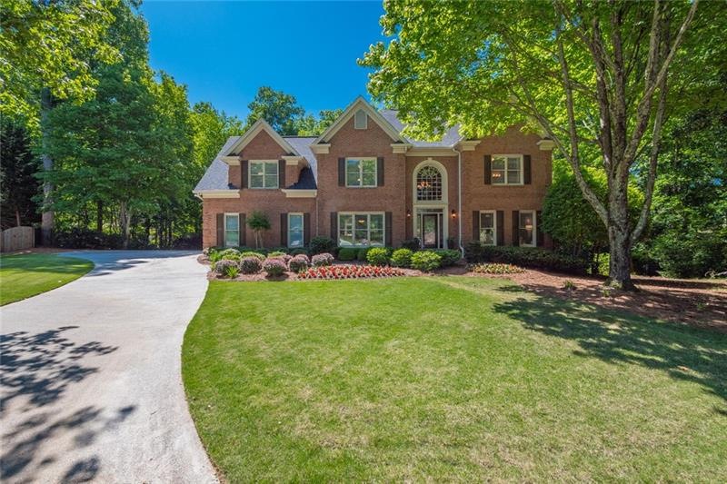 Gorgeous brick traditional with professionally lan