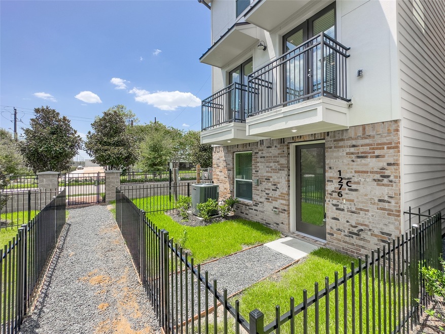 Front door entrance with enclosed front yard.