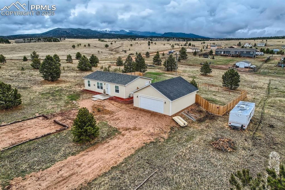 Drone / aerial view with a mountain view and a rural view