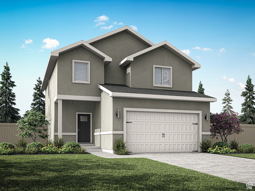 Traditional-style home featuring stucco siding, driveway, and an attached garage