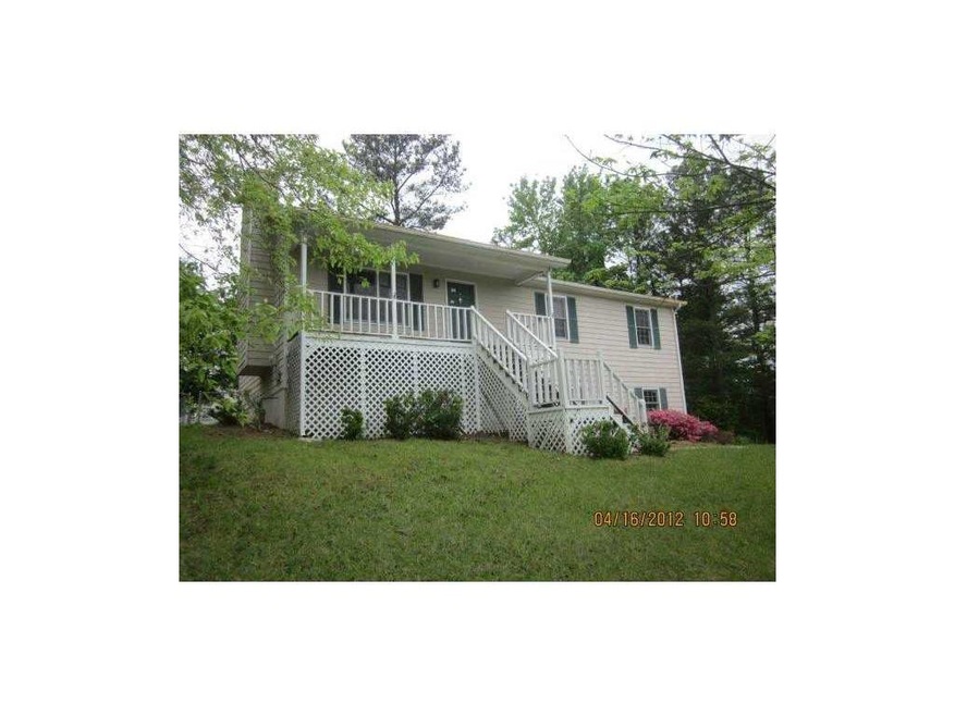 Exterior Front. Front view of house with rocking c