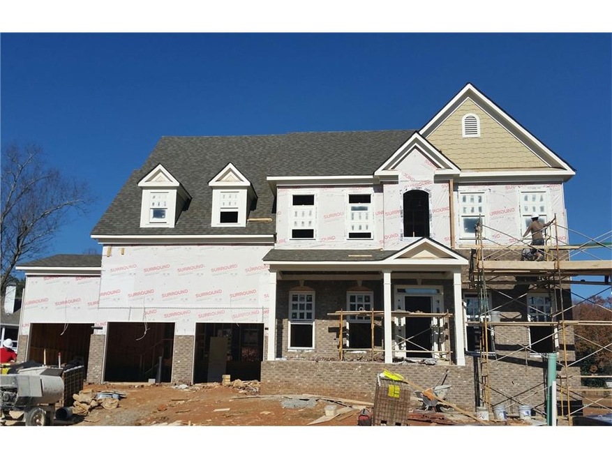 Stately brick front Westport with full front porch