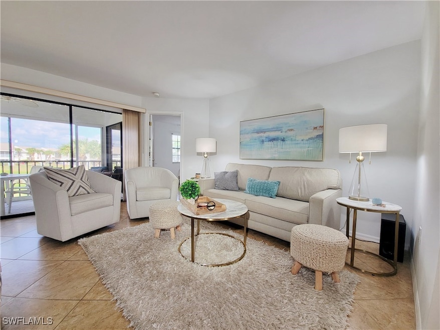 Living room featuring light tile patterned floors