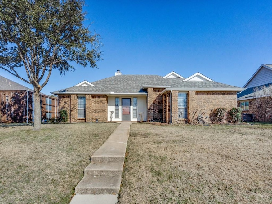 Single story home featuring cooling unit and a fro