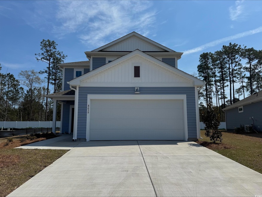 View of front facade featuring concrete driveway, 