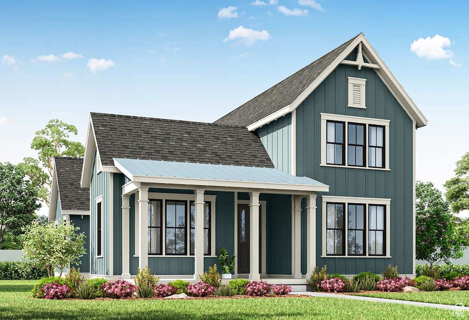 Modern farmhouse style home with board and batten siding, roof with shingles, covered porch, and a front yard