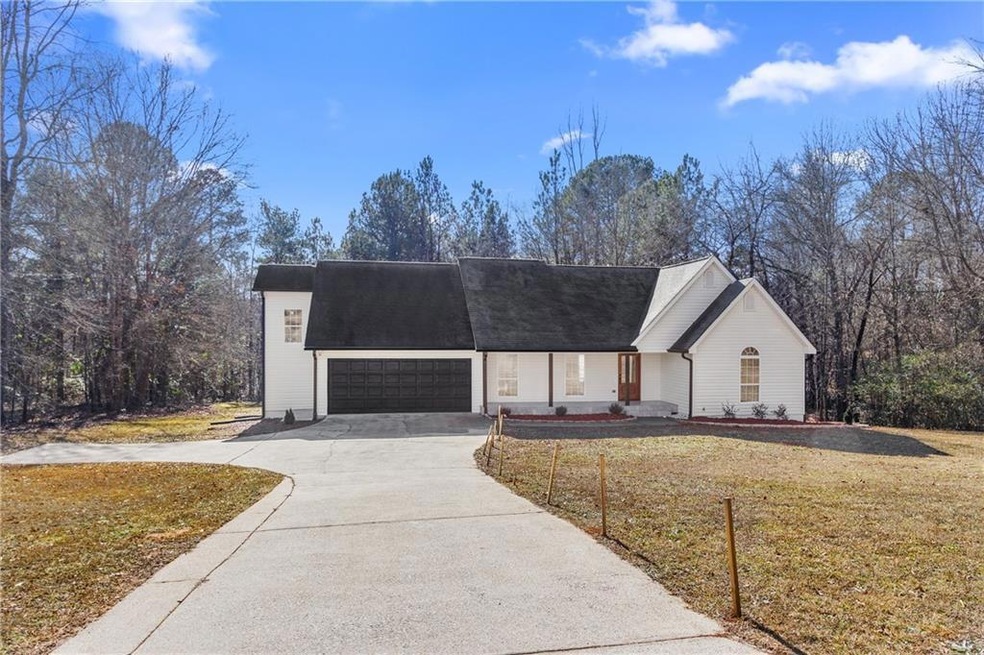 View of front of property with a garage and a fron