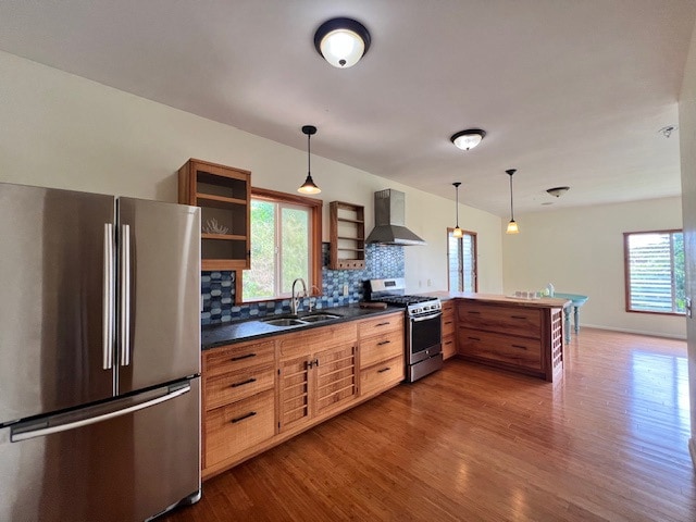 highly updated kitchen with custom cabinets, stainless appliances, modern concrete countertops and dramatic lighting. Breakfast bar has a  custom tropical wood countertop!