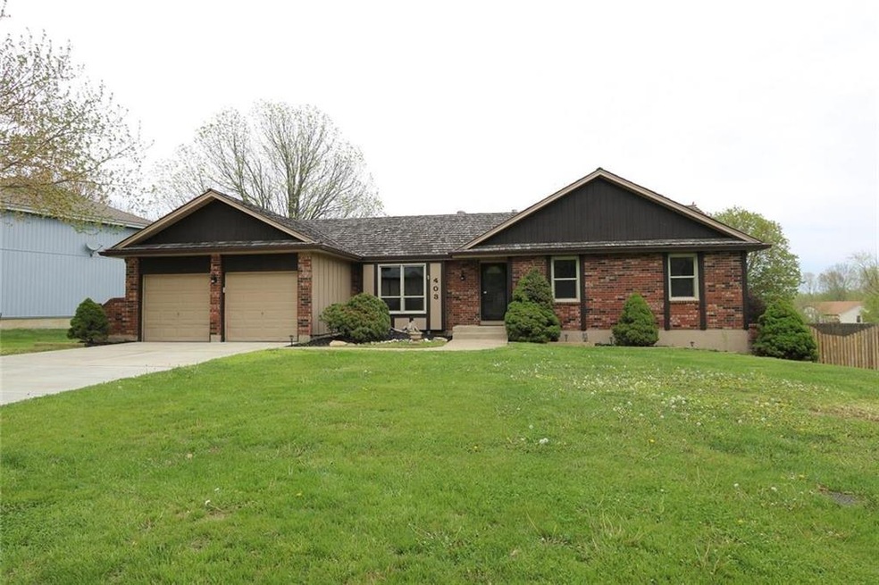 403 N Adams St, Raymore, MO 64083 - photo 1