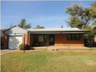 View of front of house. Full brick home with 1 car