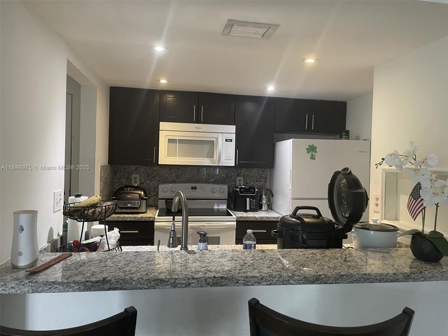 Las Brisas at Country Club of Miami unit C409, Hialeah, FL 33015 - photo 1