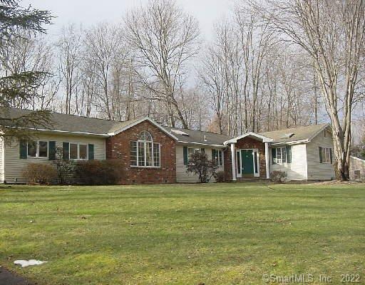 One level living on West Norwalk acre with in-grou