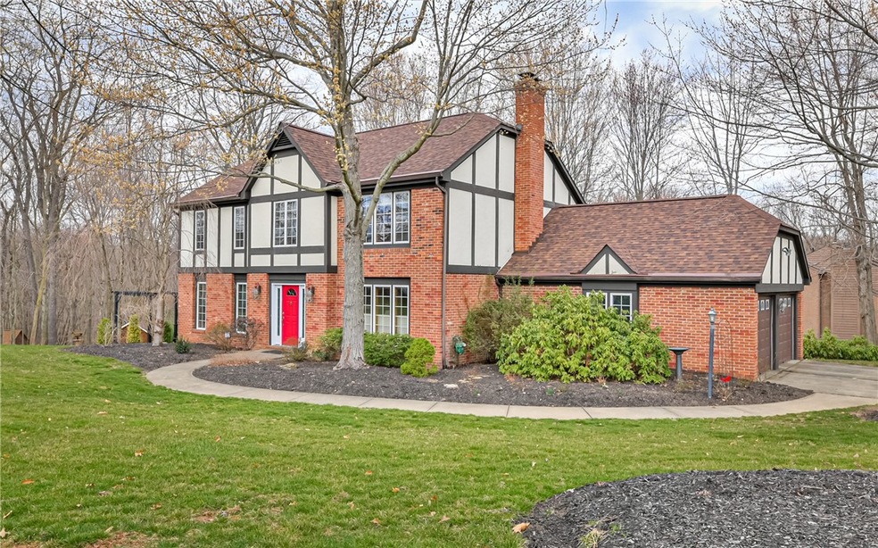 Nestled on .91 acre of private/wooded property in