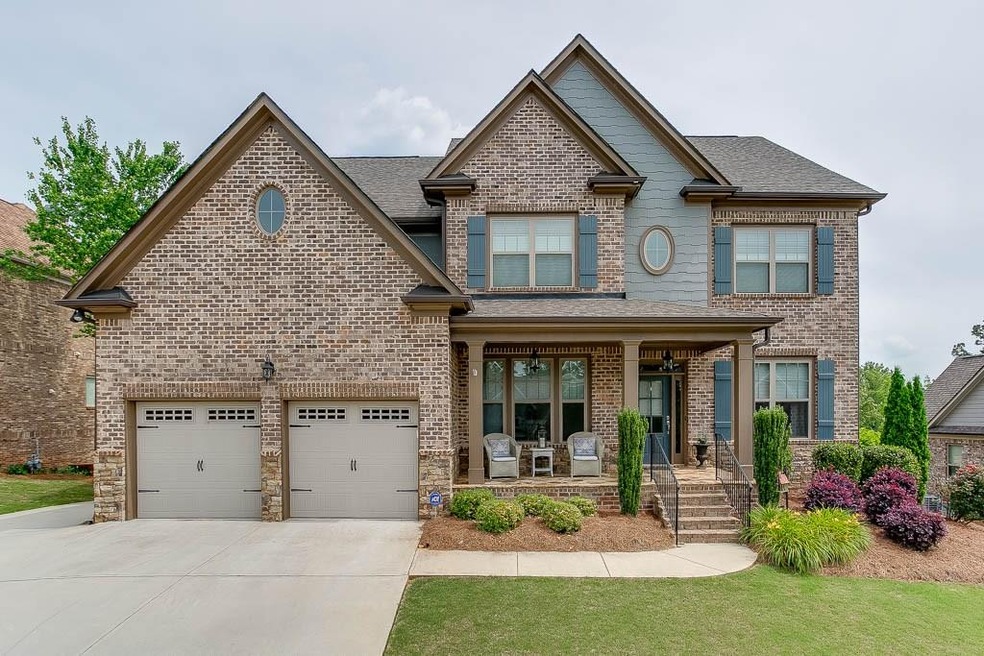 This stunning 3 side brick home is located in the 